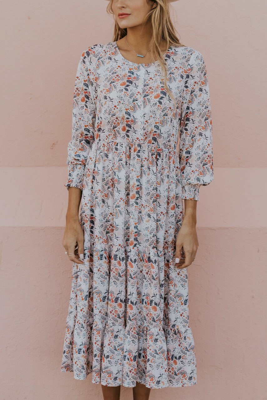 a woman in a floral dress