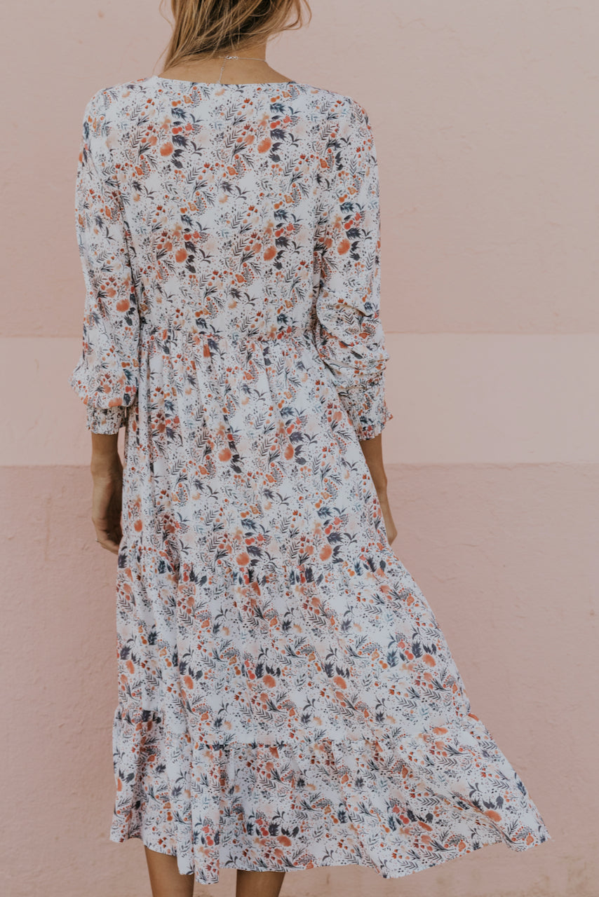 a woman in a floral dress