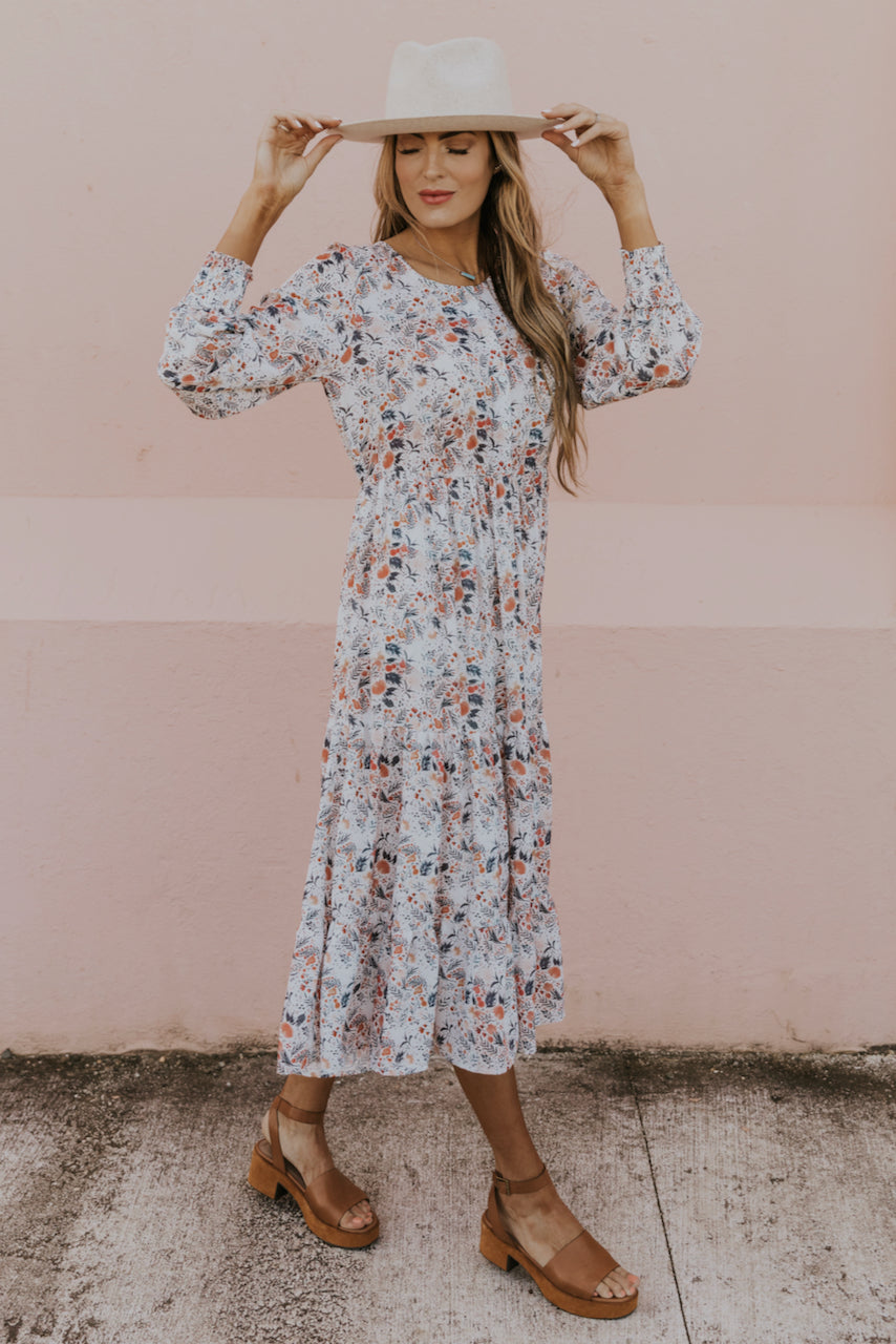 a woman in a floral dress