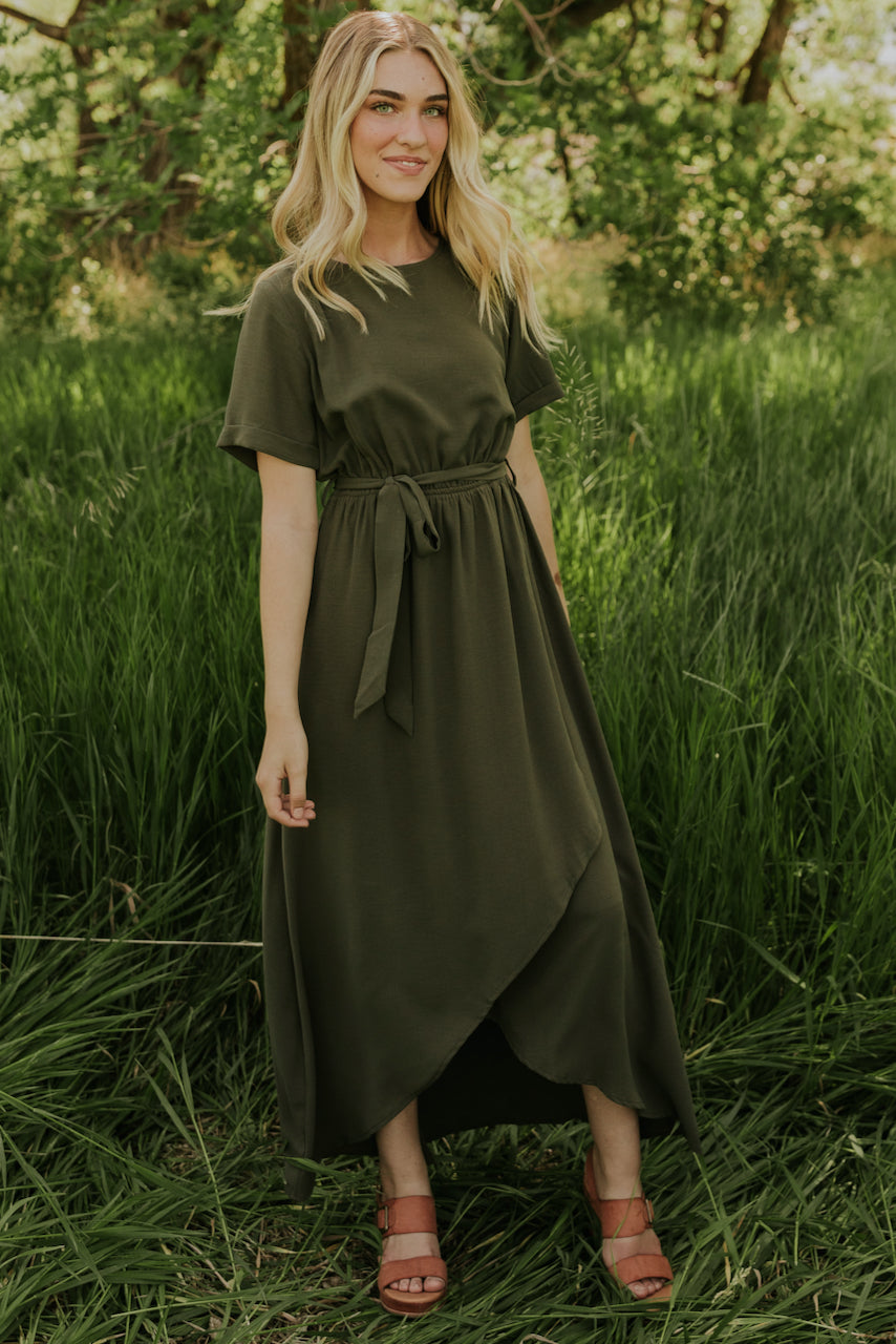 a woman in a green dress