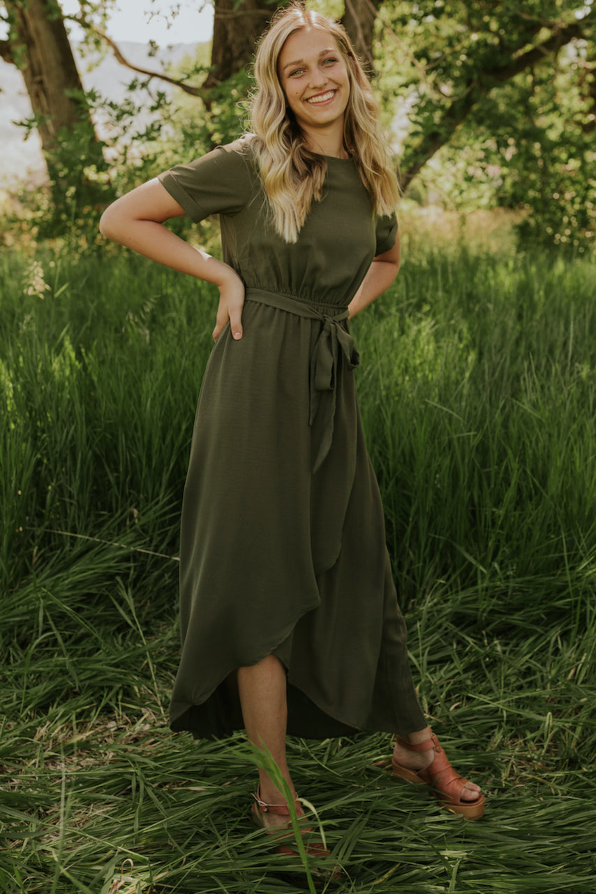 a woman in a green dress