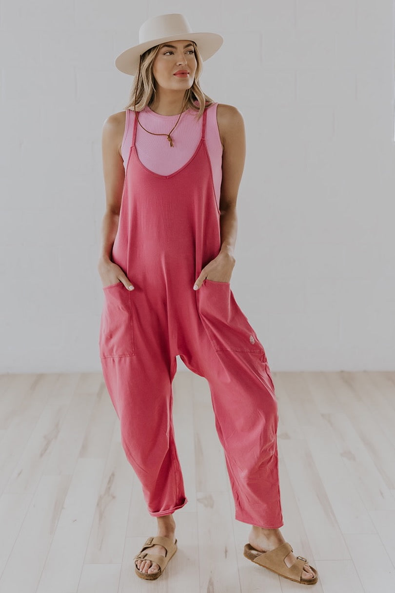 a woman in pink overalls