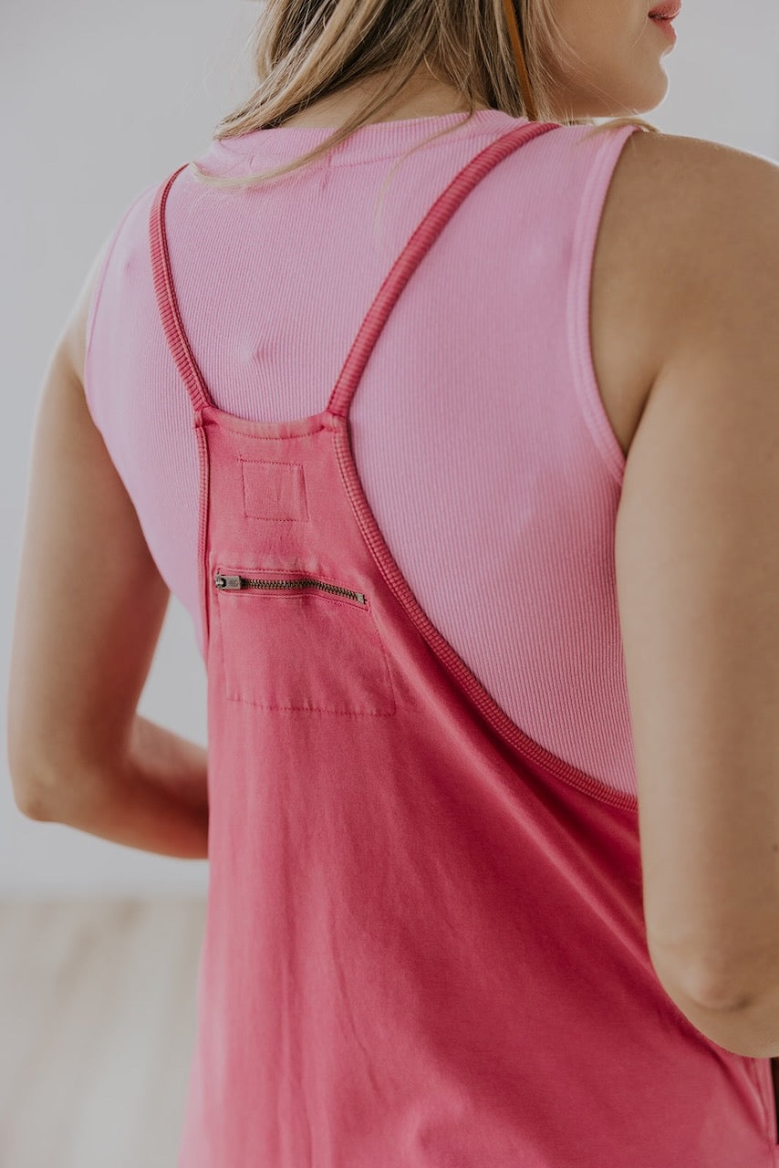 a person wearing a pink overall