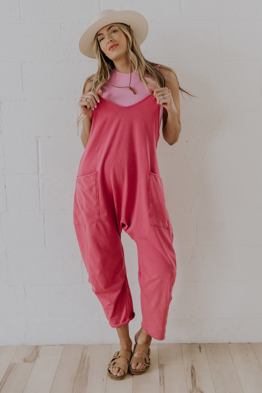 a woman in pink overalls