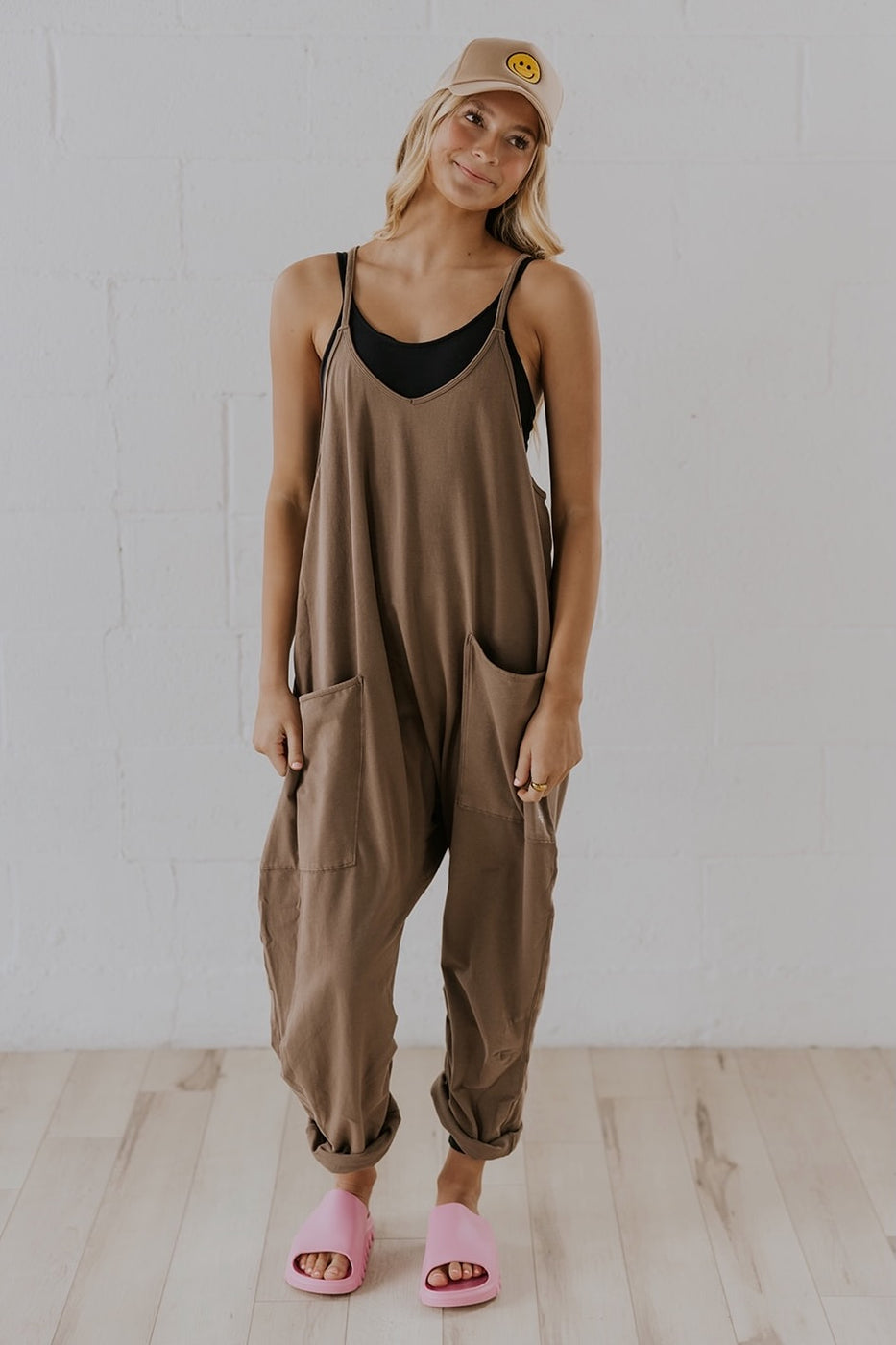 a woman in a brown jumpsuit