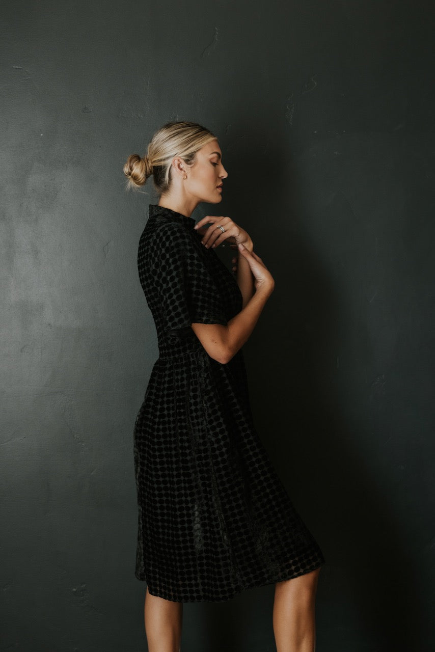 a woman in a black dress