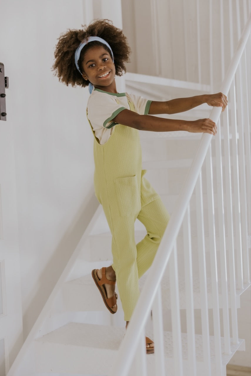 a girl standing on a staircase