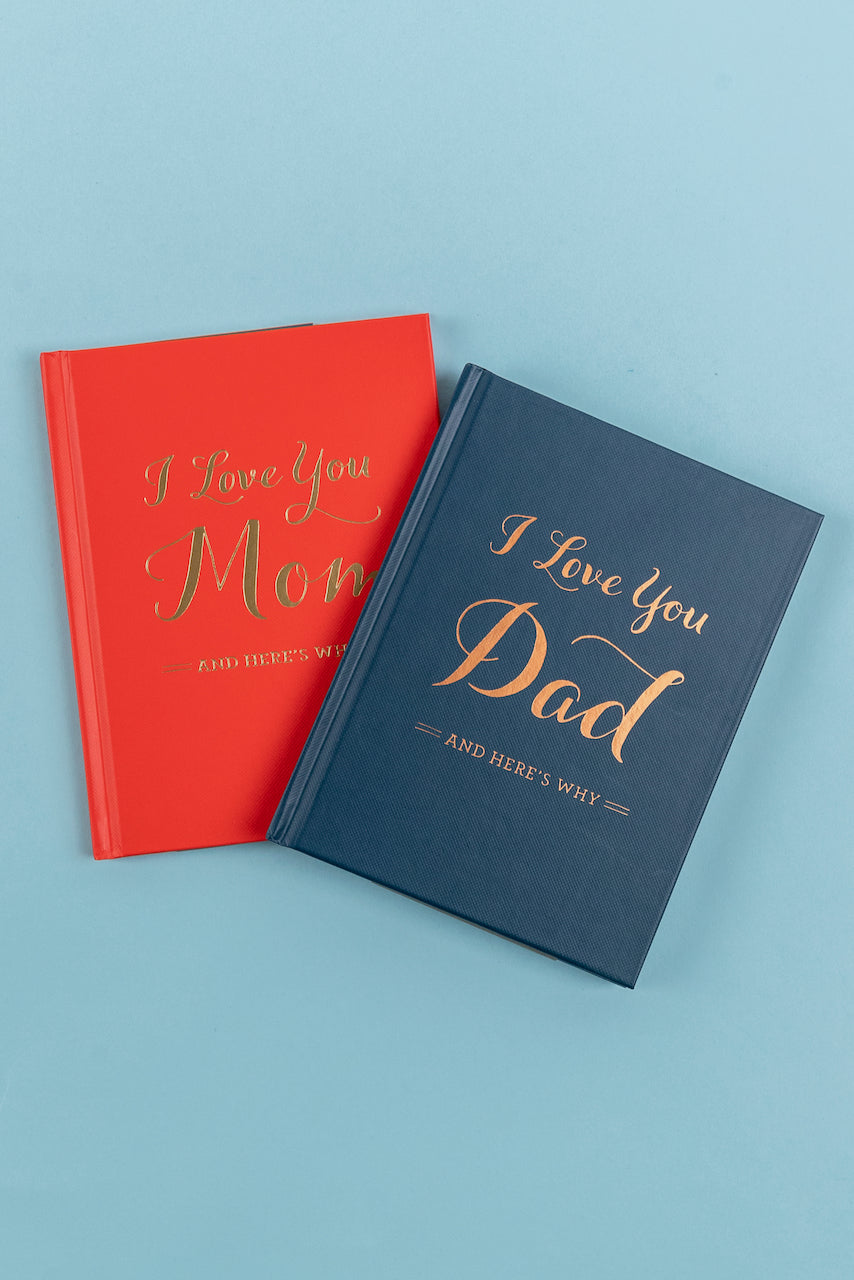 a blue and red notebooks with gold writing on them